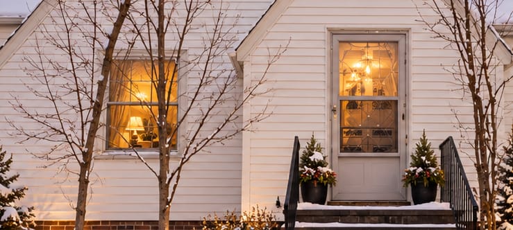Warmly lit interior seen through the windows at dusk